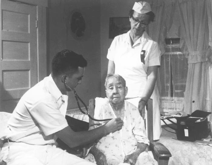 A physician providing a personal home health visit